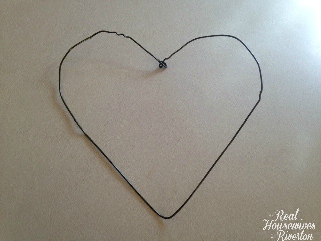 Wire hanger shaped into a heart.
