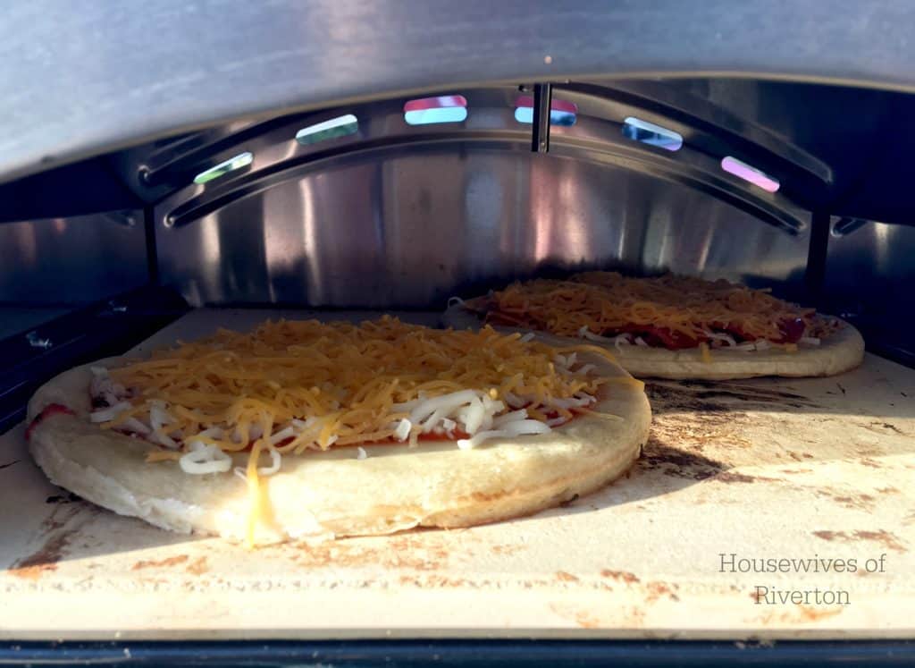 Build Your Own Pizza with Camp Chef.  The Artisan Accessory Oven is perfect for enjoying your favorite baked items outdoors! | www.housewivesofriverton.com